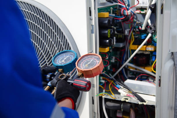 Engineer repairing a refrigeration system